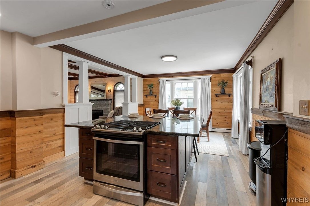 Dining room, Fireplace, Interior, Kitchen, Stainless Steel Appliances, Stone Walls, Wood Texture Flooring, Wooden Walls