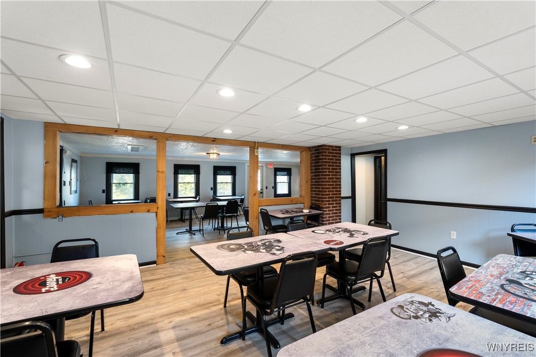 Dining room, Game Room, Interior, Recessed Lighting, Stone Walls, Wood Texture Flooring