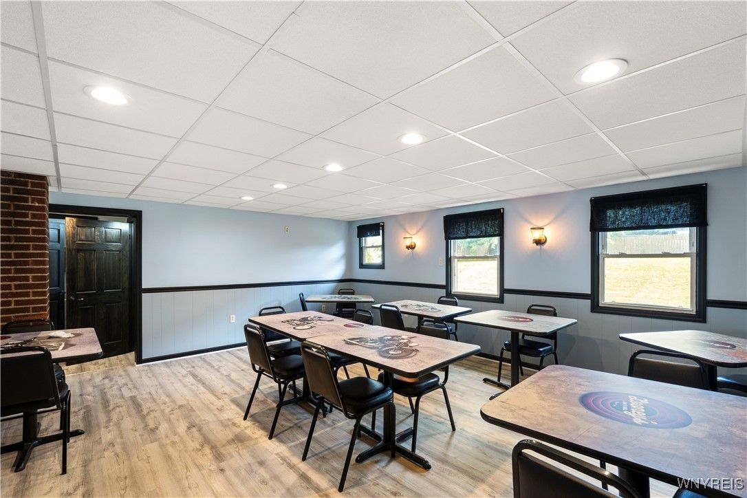 Dining room, Interior, Projection Screen, Recessed Lighting, Stone Walls, Wood Texture Flooring
