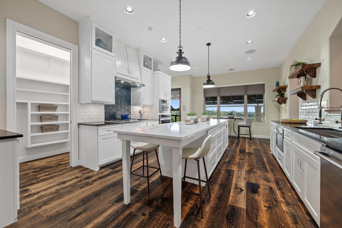 Dining room, Interior, Kitchen, Pendant Lights, Recessed Lighting, Stainless Steel Appliances, Wood Texture Flooring