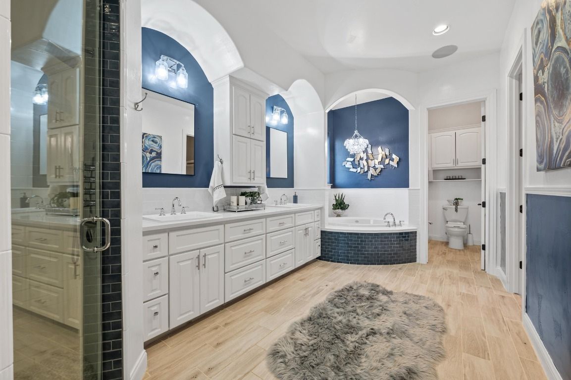 Bathroom, Chandelier, Dual Sink Vanities, Interior, Recessed Lighting, Wood Texture Flooring