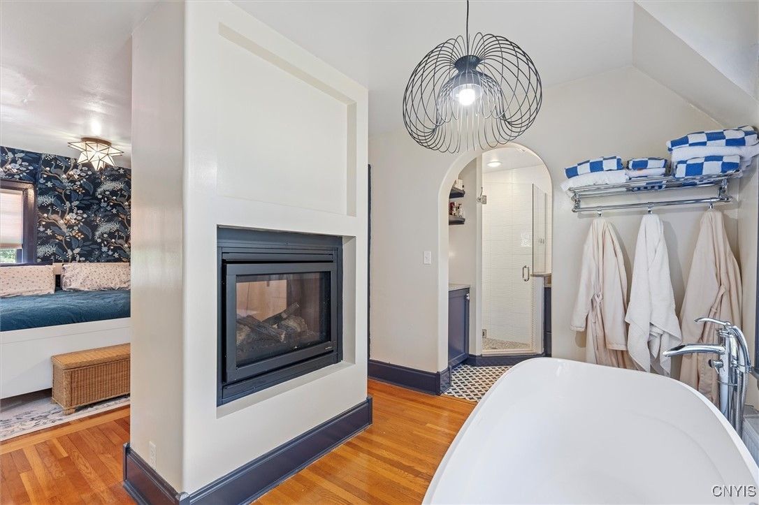 Bathroom, Fireplace, Free Standing Baths, Interior, Pendant Lights, Wood Texture Flooring