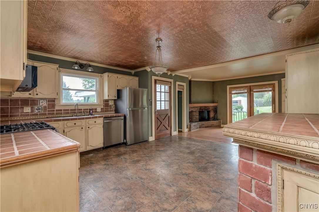 Fireplace, Interior, Kitchen, Pendant Lights, Tile Countertops