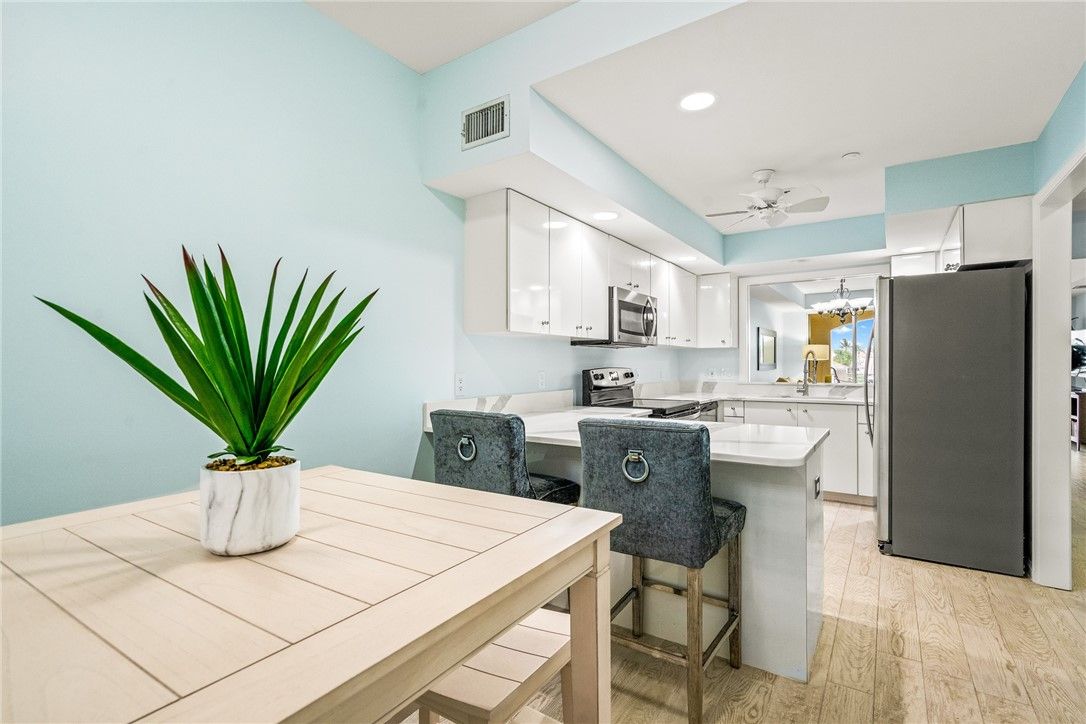 Dining room, Interior, Kitchen, Recessed Lighting, Stainless Steel Appliances, Wood Texture Flooring
