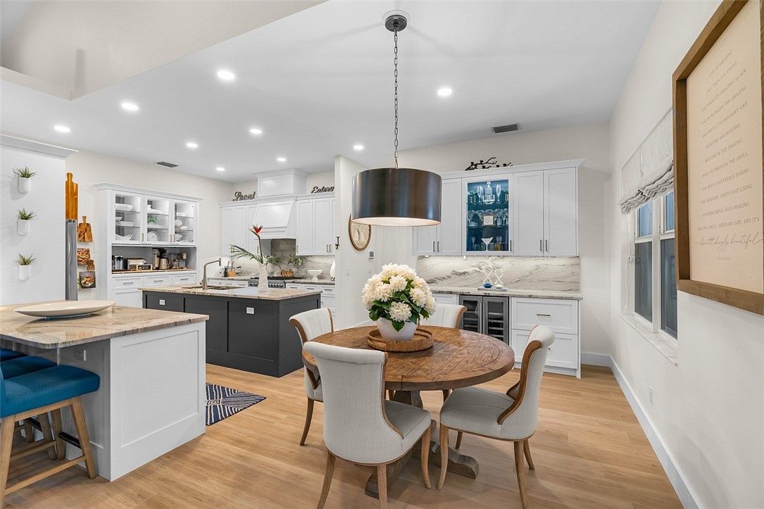 Dining room, Interior, Kitchen, Pendant Lights, Recessed Lighting, Stainless Steel Appliances, Wood Texture Flooring