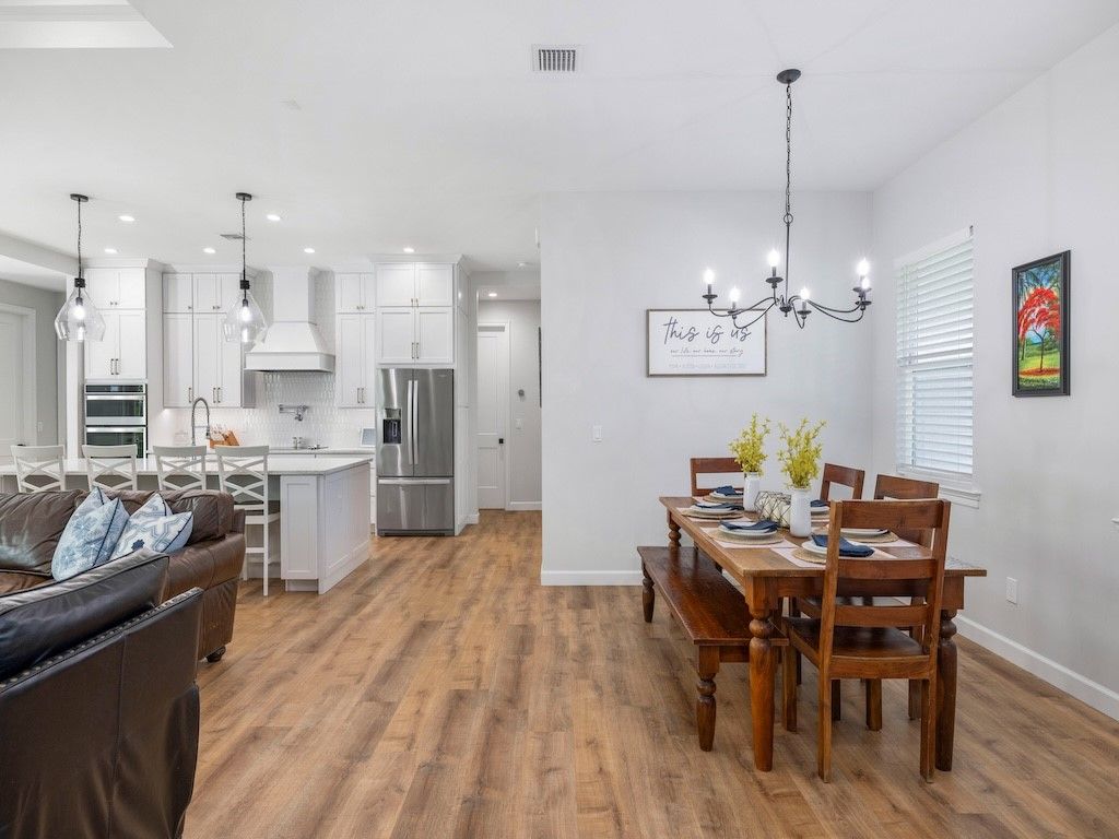 Chandelier, Dining room, Interior, Kitchen, Pendant Lights, Recessed Lighting, Stainless Steel Appliances, Wood Texture Flooring