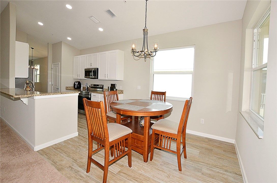 Chandelier, Dining room, Interior, Kitchen, Recessed Lighting, Stainless Steel Appliances, Wood Texture Flooring