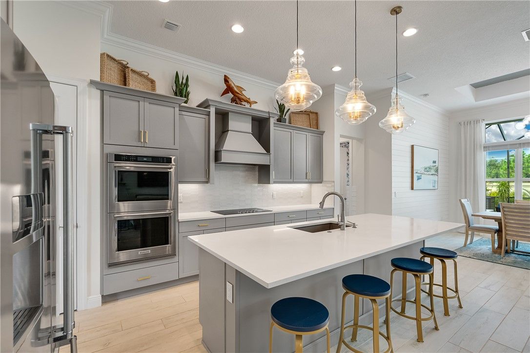 Dining room, Interior, Kitchen, Pendant Lights, Recessed Lighting, Stainless Steel Appliances, Wood Texture Flooring