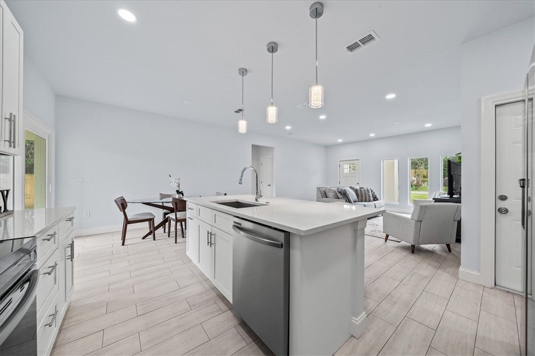 Dining room, Interior, Kitchen, Living room, Pendant Lights, Recessed Lighting, Stainless Steel Appliances, Wood Texture Flooring