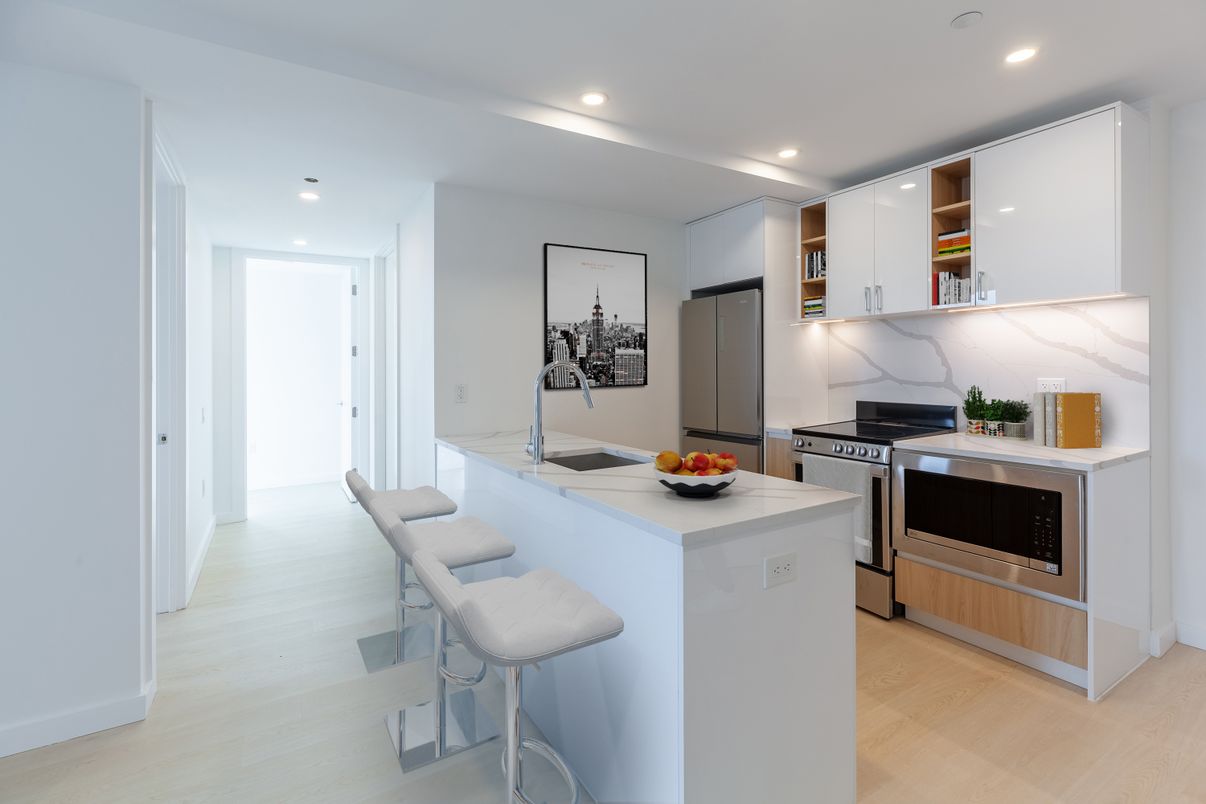 Interior, Kitchen, Marble Walls, Recessed Lighting, Stainless Steel Appliances