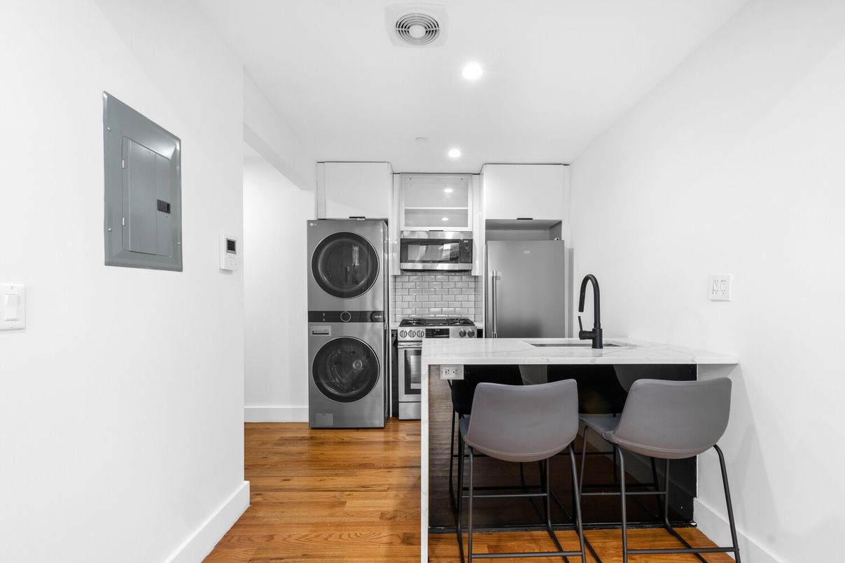 Interior, Kitchen, Recessed Lighting, Washer, Wood Texture Flooring
