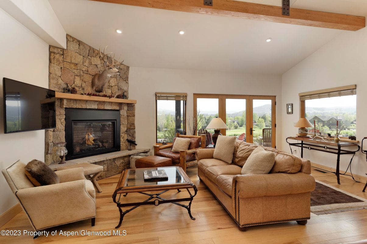 Fireplace, Interior, Living room, Recessed Lighting, Stone Walls, Wooden Beams, Wood Texture Flooring