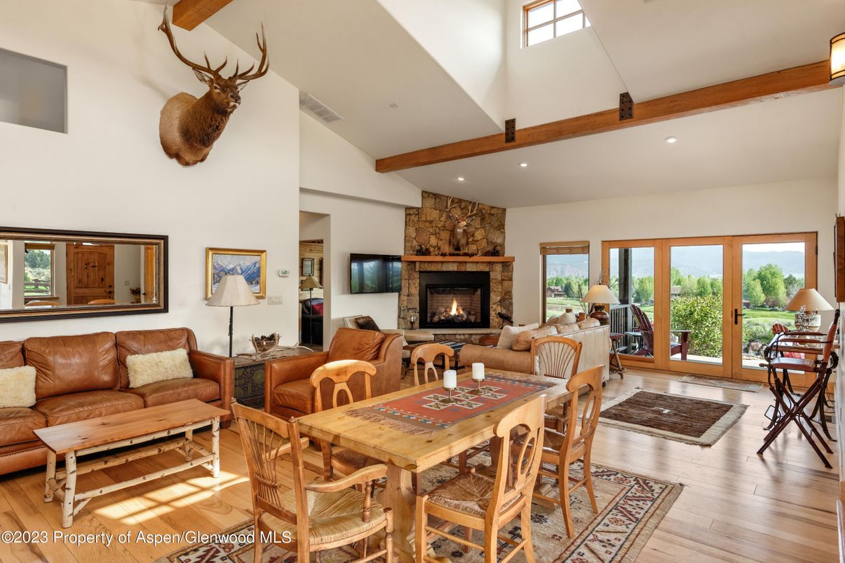 Dining room, Fireplace, Interior, Living room, Recessed Lighting, Stone Walls, Wooden Beams, Wood Texture Flooring