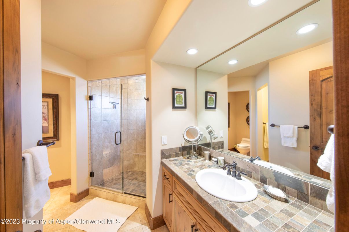 Bathroom, Dual Sink Vanities, Glass Shower, Interior, Recessed Lighting, Tile Countertops
