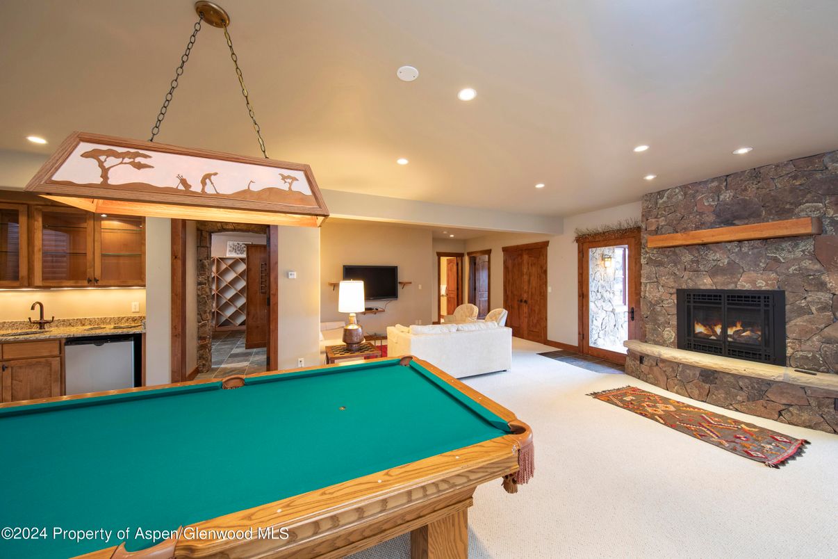 Billiard Table, Fireplace, Game Room, Interior, Pendant Lights, Recessed Lighting, Stone Walls