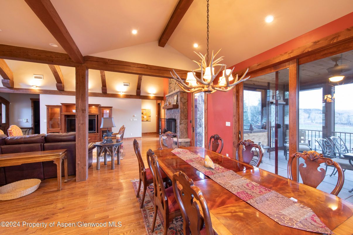 Chandelier, Dining room, Fireplace, Interior, Living room, Recessed Lighting, Wooden Beams, Wood Texture Flooring