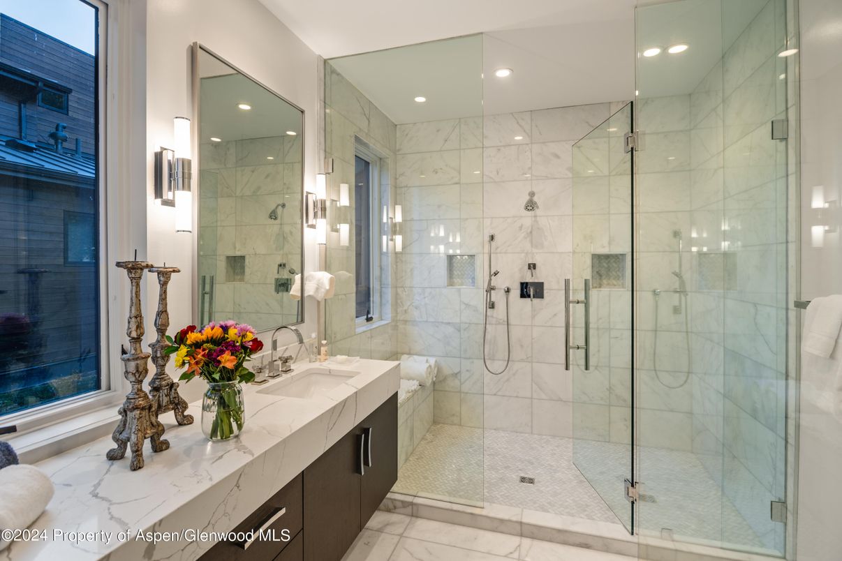Bathroom, Dual Sink Vanities, Glass Shower, Interior, Marble, Marble Walls, Recessed Lighting