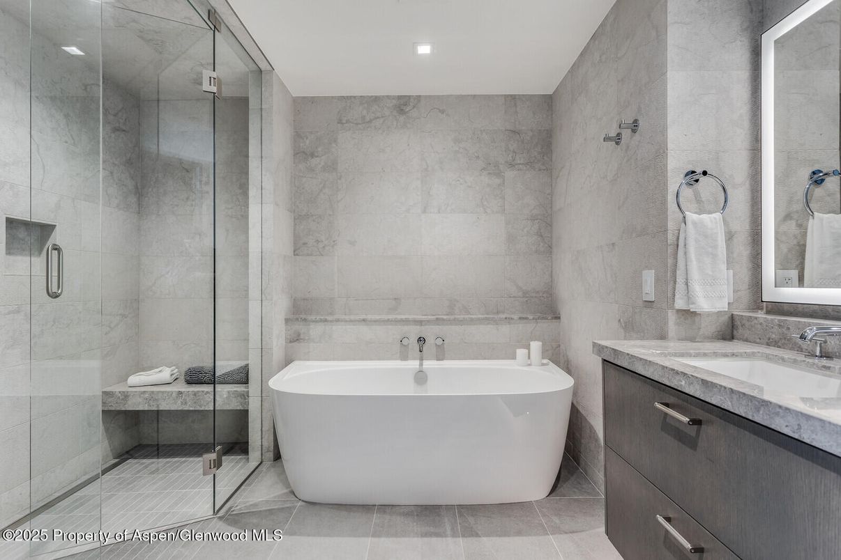 Bathroom, Free Standing Baths, Glass Shower, Interior, Marble Walls, Recessed Lighting