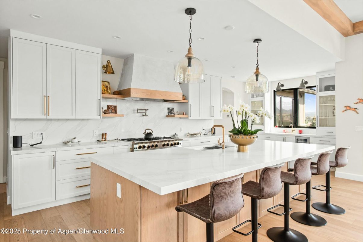 Interior, Kitchen, Marble Walls, Pendant Lights, Recessed Lighting, Stainless Steel Appliances, Wood Texture Flooring
