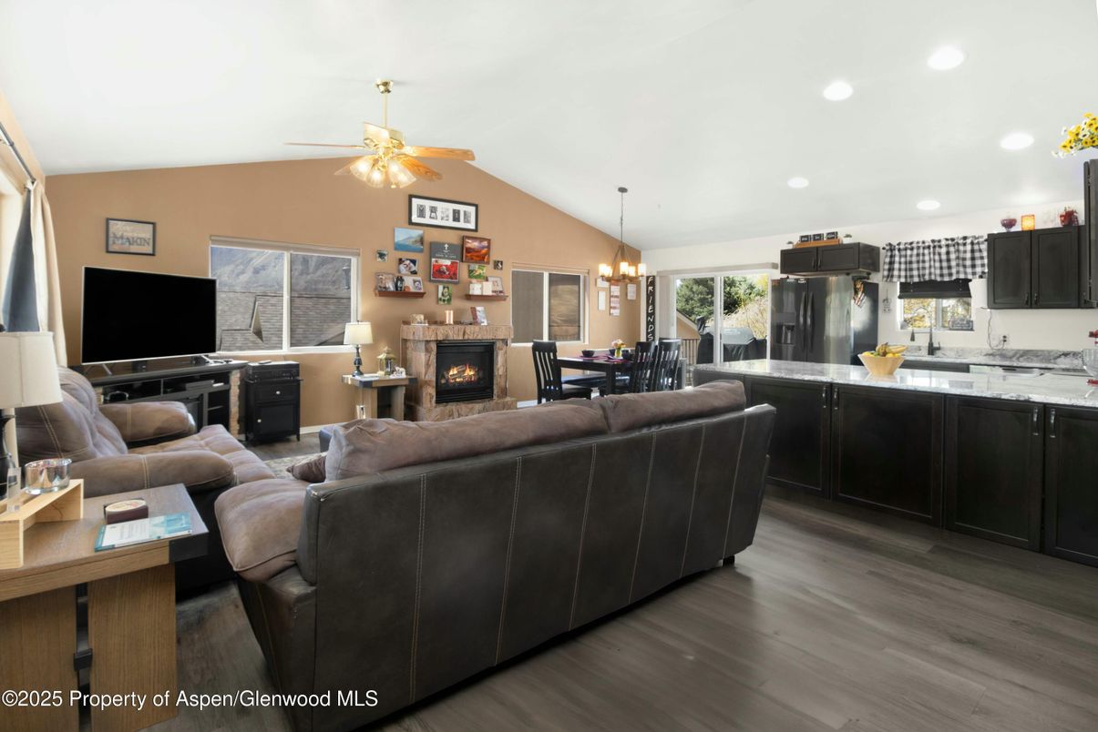 Chandelier, Dining room, Fireplace, Interior, Kitchen, Living room, Recessed Lighting, Wood Texture Flooring