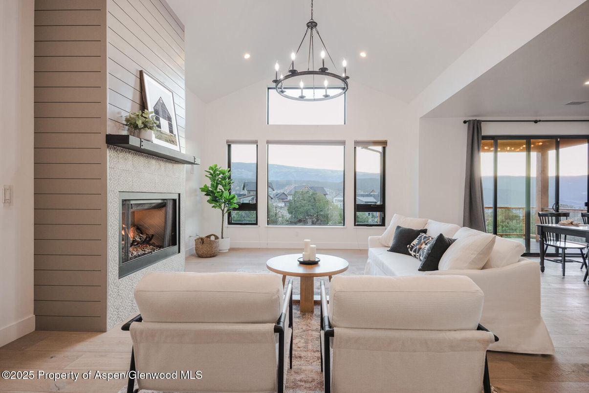 Dining room, Fireplace, Interior, Living room, Pendant Lights, Recessed Lighting, Water, Wood Texture Flooring