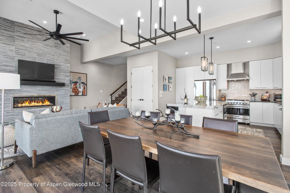 Dining room, Fireplace, Interior, Kitchen, Living room, Pendant Lights, Recessed Lighting, Stainless Steel Appliances, Stone Walls, Wood Texture Flooring