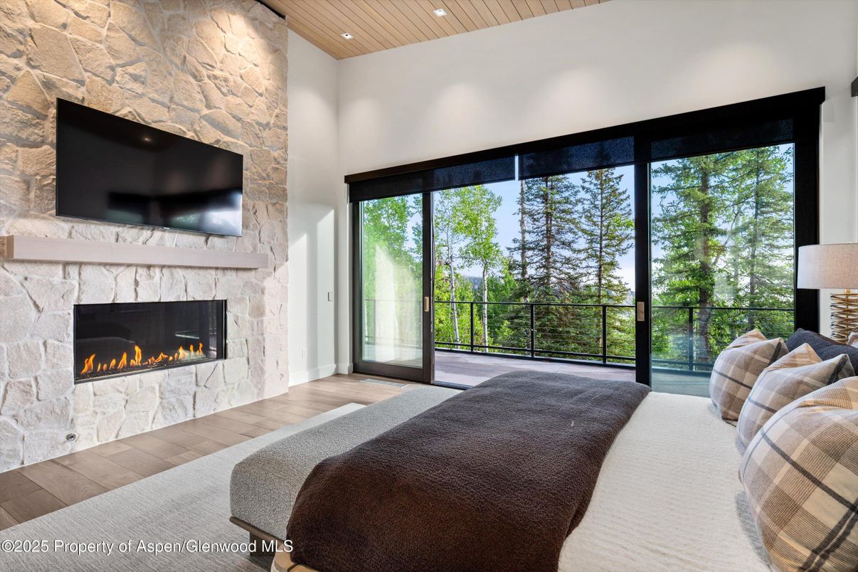 Bedroom, Fireplace, Interior, Recessed Lighting, Stone Walls, Wooden Ceilings, Wood Texture Flooring