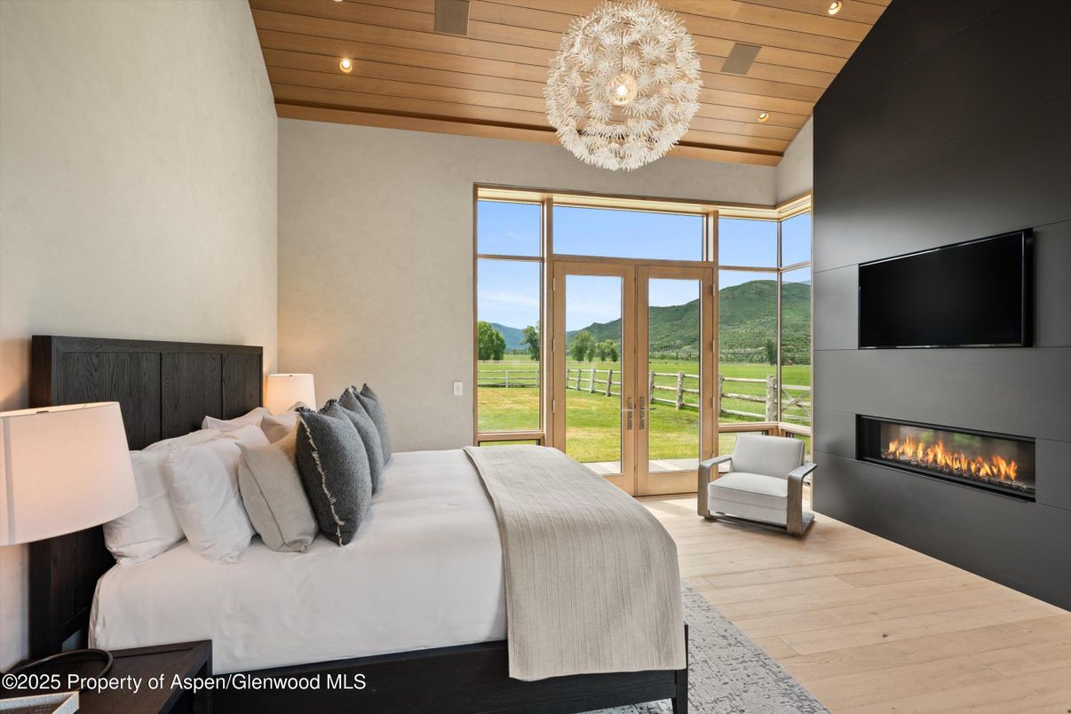 Bedroom, Chandelier, Fireplace, Interior, Recessed Lighting, Wooden Ceilings, Wood Texture Flooring