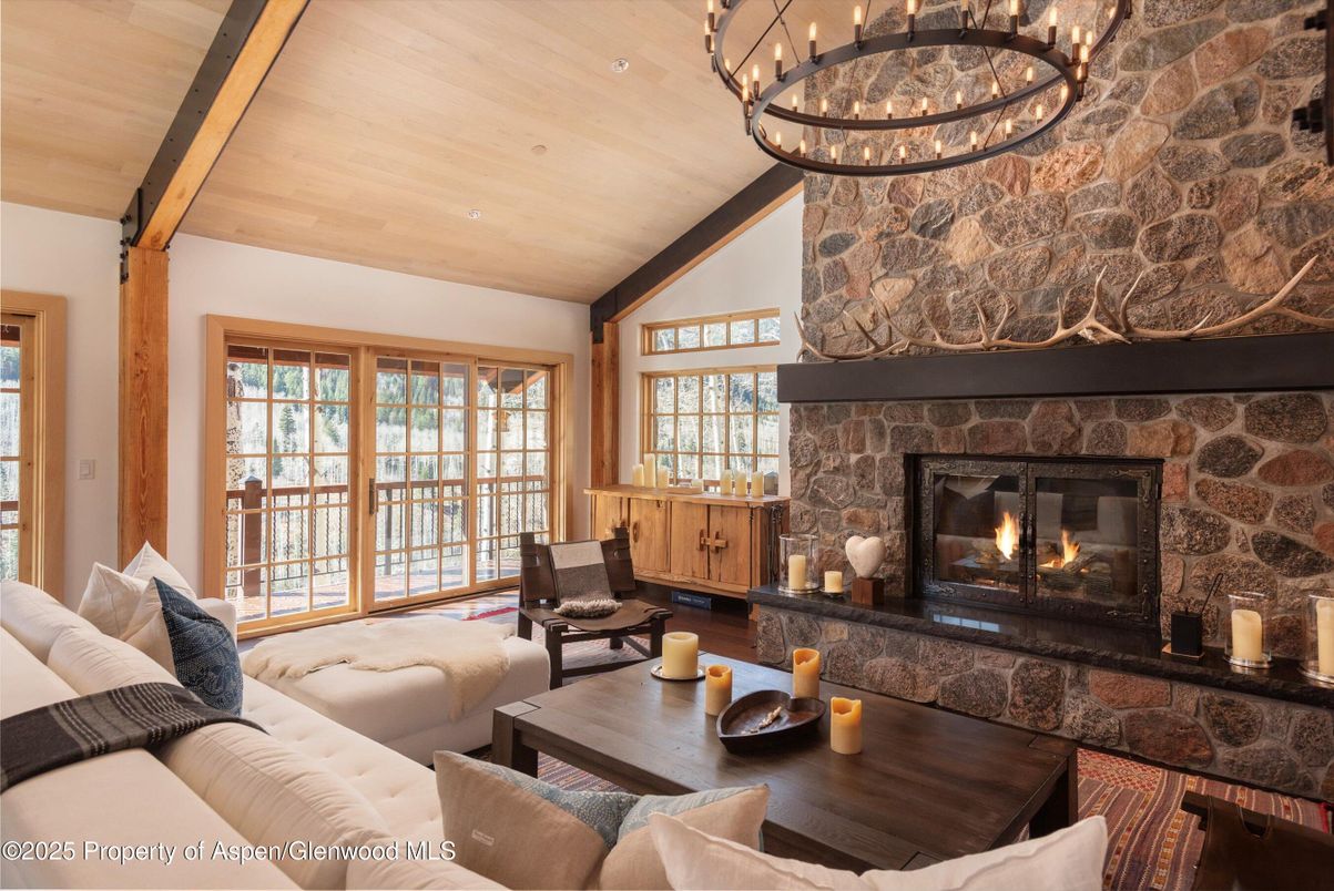Chandelier, Fireplace, Interior, Living room, Stone Walls, Wooden Beams, Wooden Ceilings