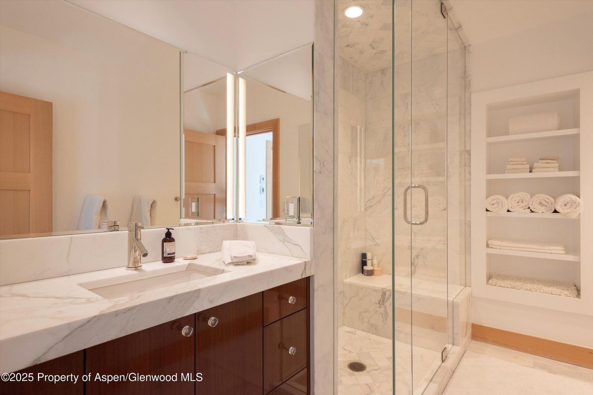Bathroom, Dual Sink Vanities, Glass Shower, Interior, Marble Walls, Recessed Lighting