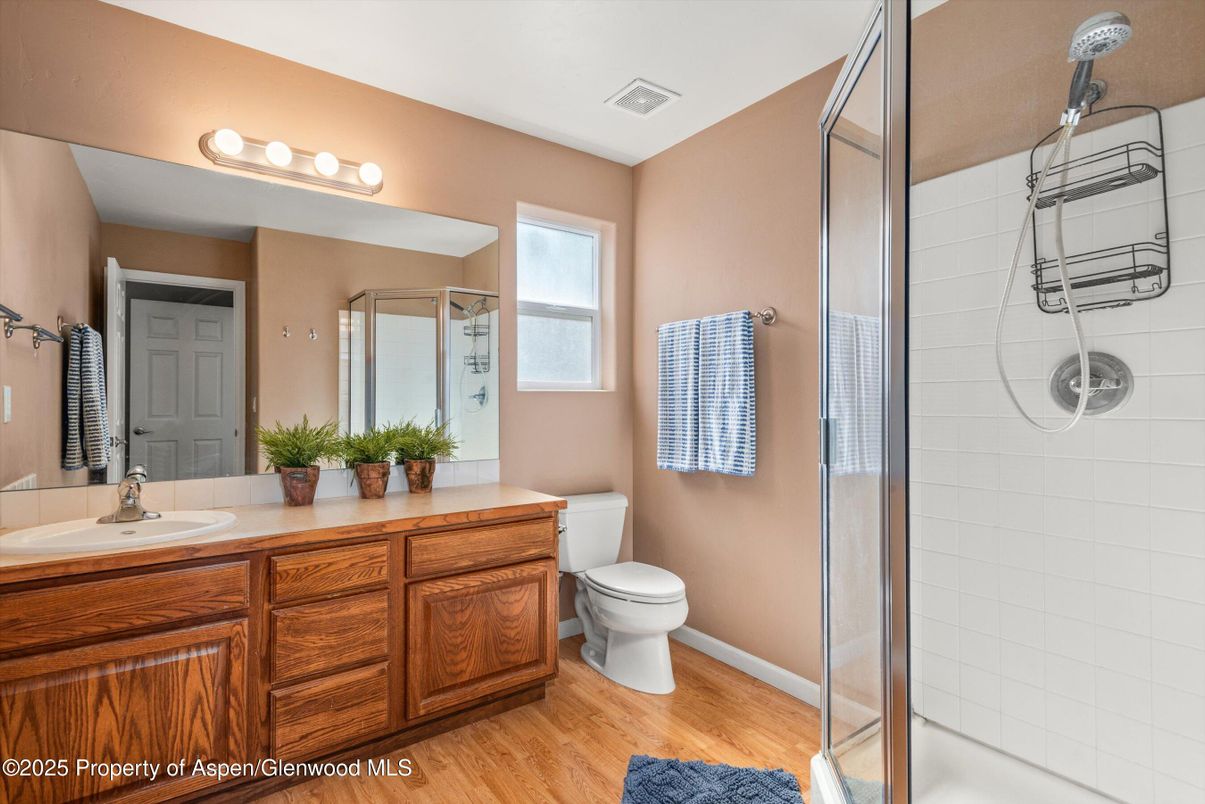 Bathroom, Dual Sink Vanities, Glass Shower, Interior, Wood Texture Flooring