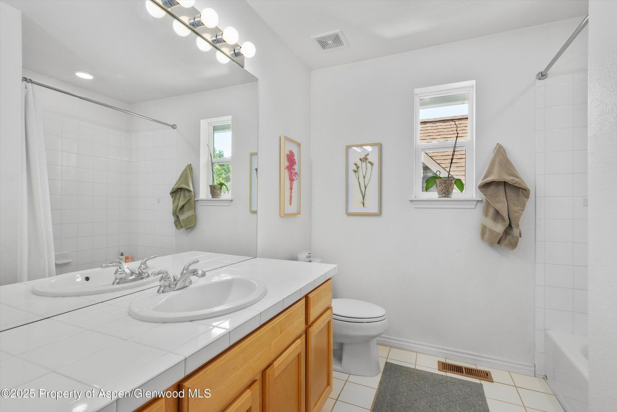 Bathroom, Dual Sink Vanities, Interior, Recessed Lighting, Tile Countertops