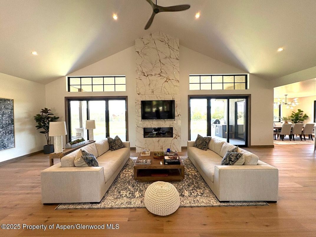 Dining room, Fireplace, Interior, Living room, Recessed Lighting, Wood Texture Flooring