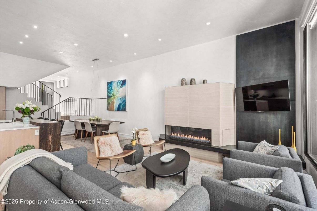 Dining room, Fireplace, Interior, Living room, Pendant Lights, Recessed Lighting, Wood Texture Flooring