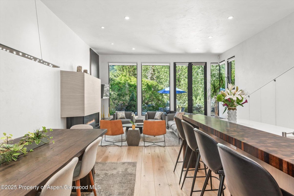 Dining room, Fireplace, Interior, Living room, Recessed Lighting, Wood Texture Flooring