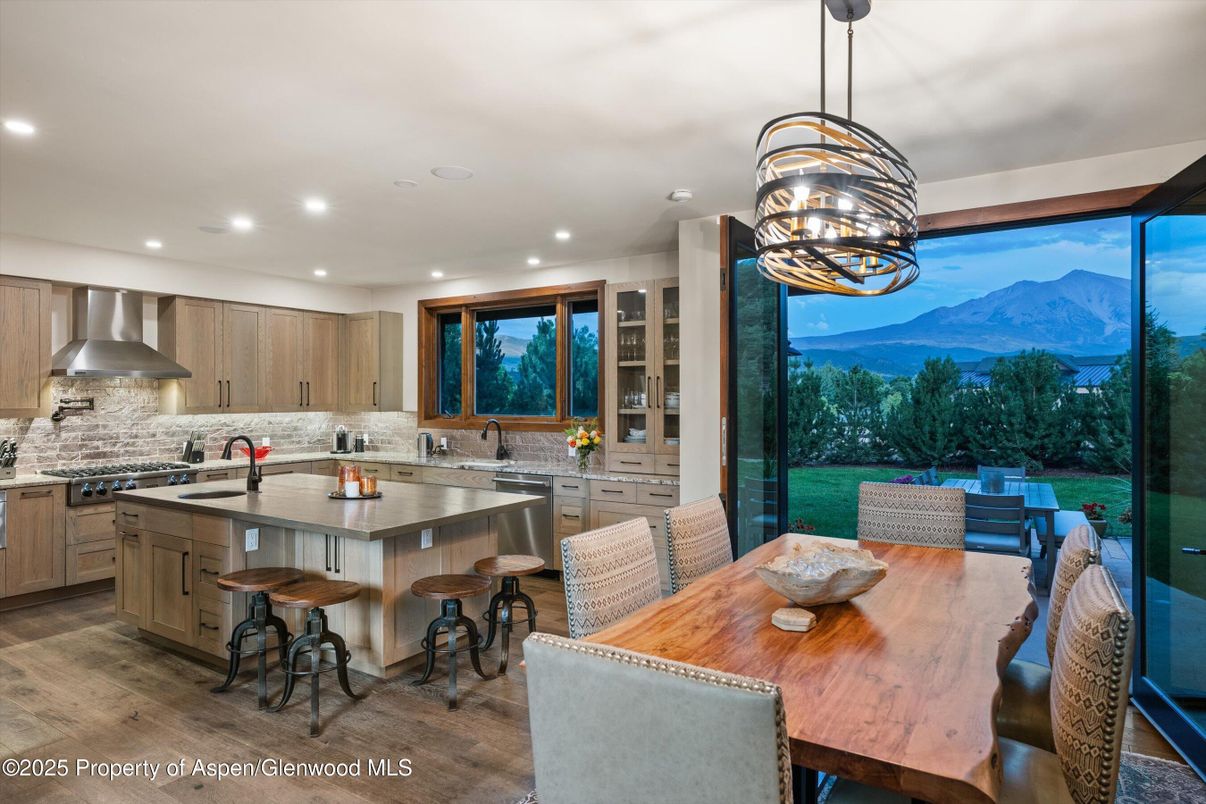 Dining room, Interior, Kitchen, Pendant Lights, Recessed Lighting, Stainless Steel Appliances, Wood Texture Flooring