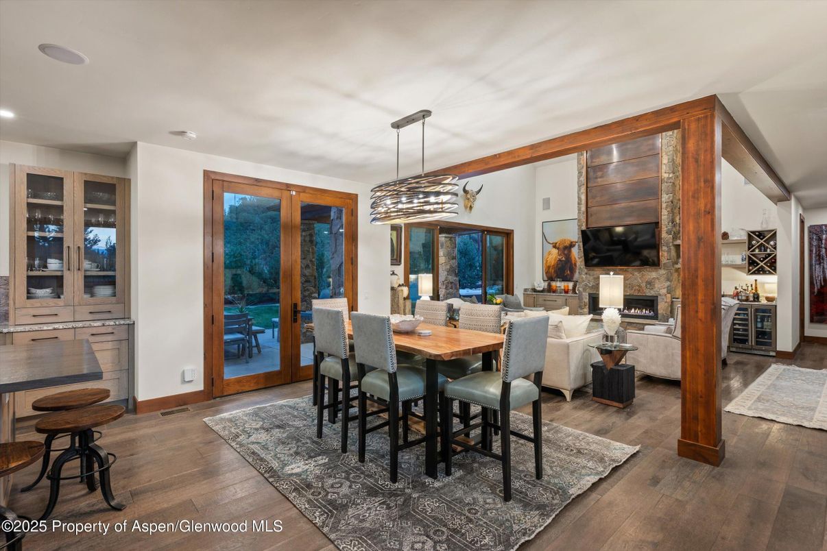 Dining room, Fireplace, Interior, Living room, Pendant Lights, Recessed Lighting, Wood Texture Flooring