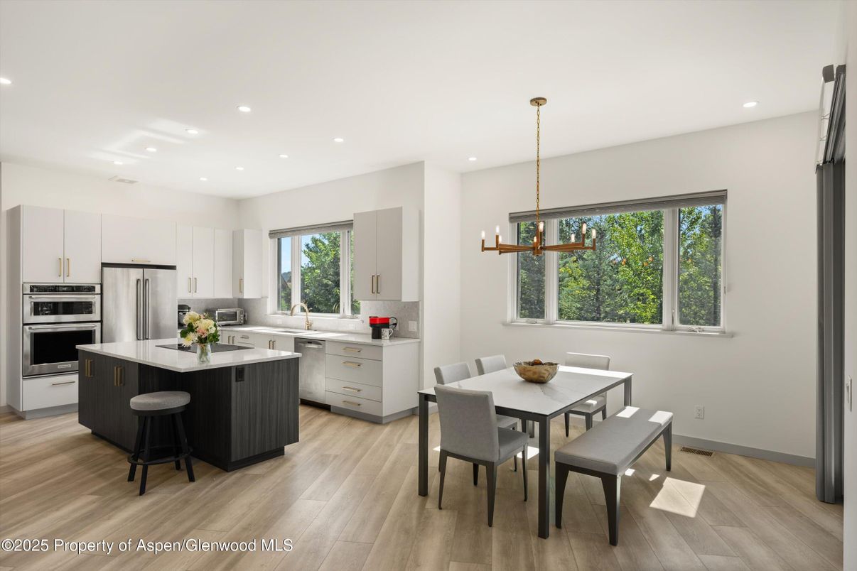 Dining room, Interior, Kitchen, Pendant Lights, Recessed Lighting, Stainless Steel Appliances, Wood Texture Flooring