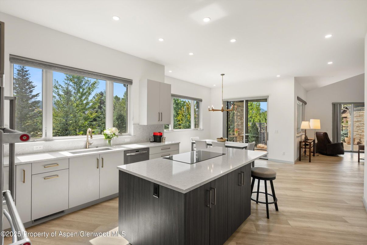 Dining room, Interior, Kitchen, Pendant Lights, Recessed Lighting, Stainless Steel Appliances, Wood Texture Flooring
