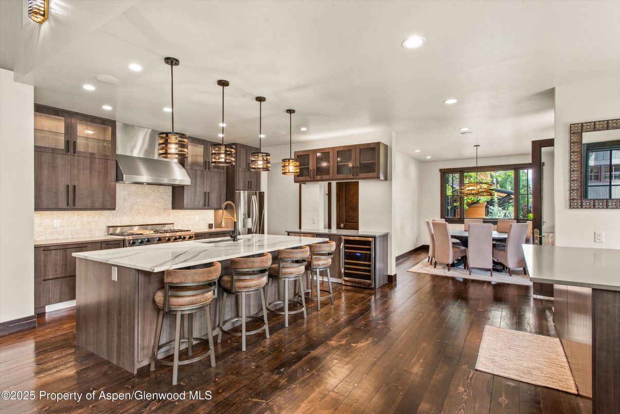 Dining room, Interior, Kitchen, Pendant Lights, Recessed Lighting, Stainless Steel Appliances, Wood Texture Flooring