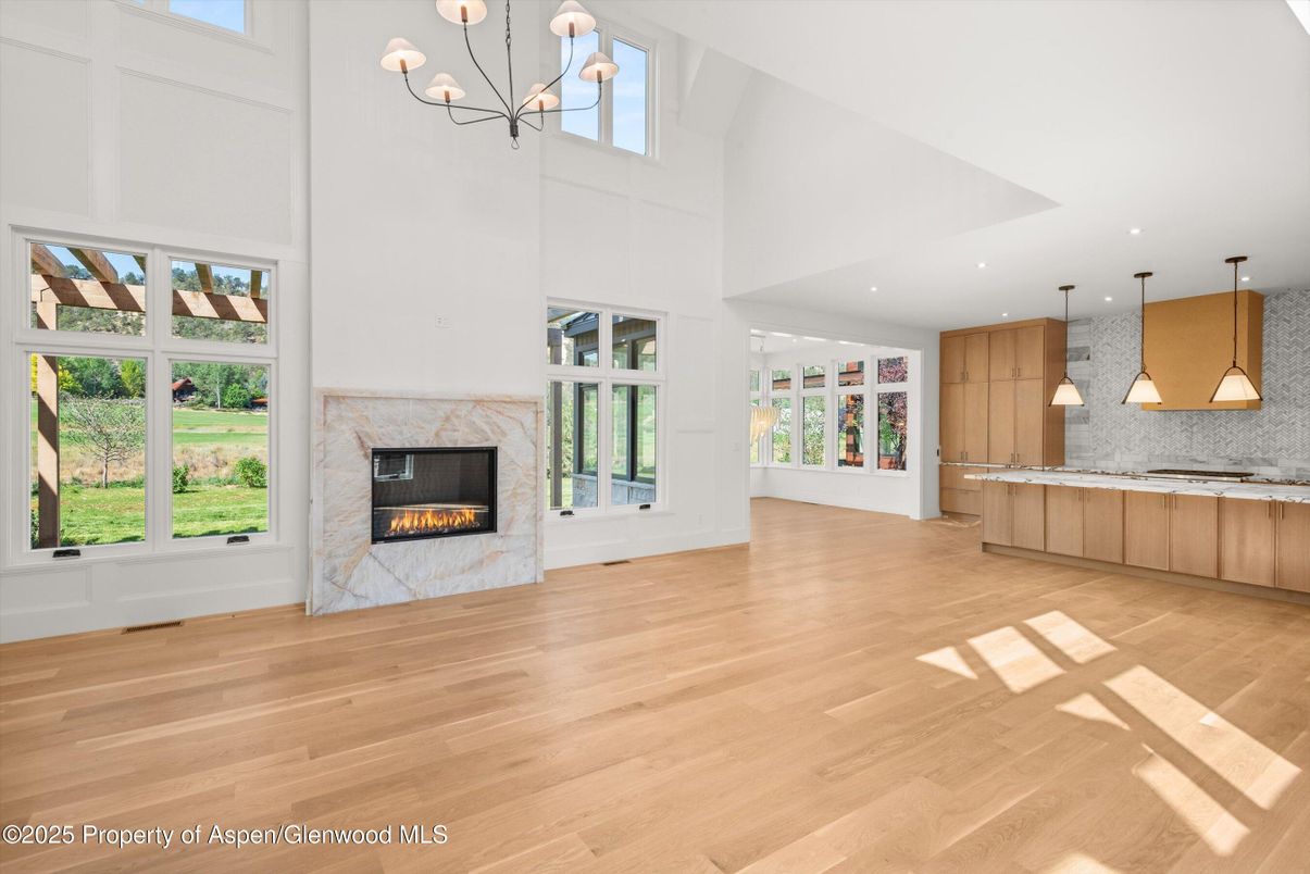 Empty room, Fireplace, Interior, Kitchen, Pendant Lights, Recessed Lighting, Wood Texture Flooring