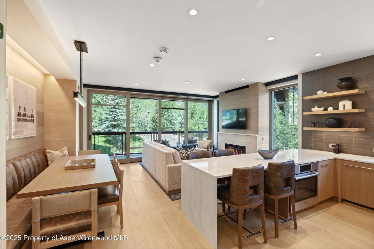Dining room, Fireplace, Interior, Living room, Pendant Lights, Recessed Lighting, Wood Texture Flooring