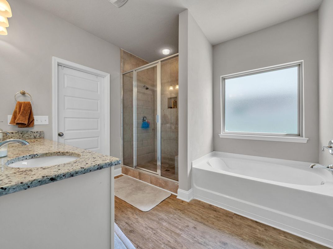 Bathroom, Dual Sink Vanities, Glass Shower, Interior, Recessed Lighting, Wood Texture Flooring