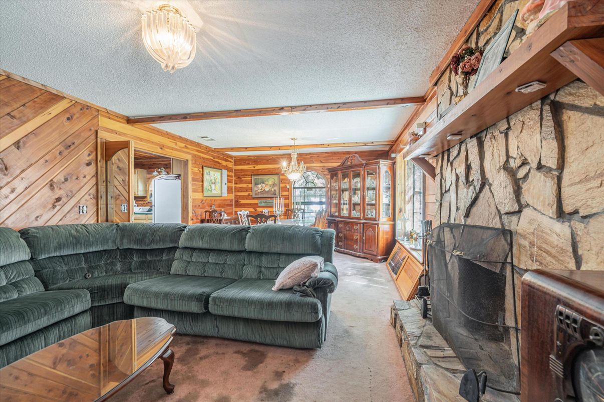 Chandelier, Dining room, Fireplace, Interior, Living room, Stone Walls, Wooden Walls