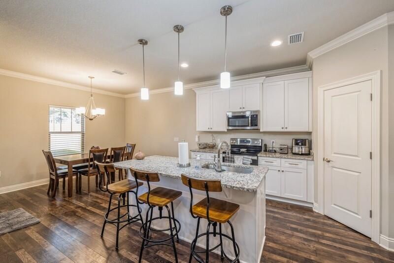 Dining room, Interior, Kitchen, Pendant Lights, Recessed Lighting, Stainless Steel Appliances, Wood Texture Flooring