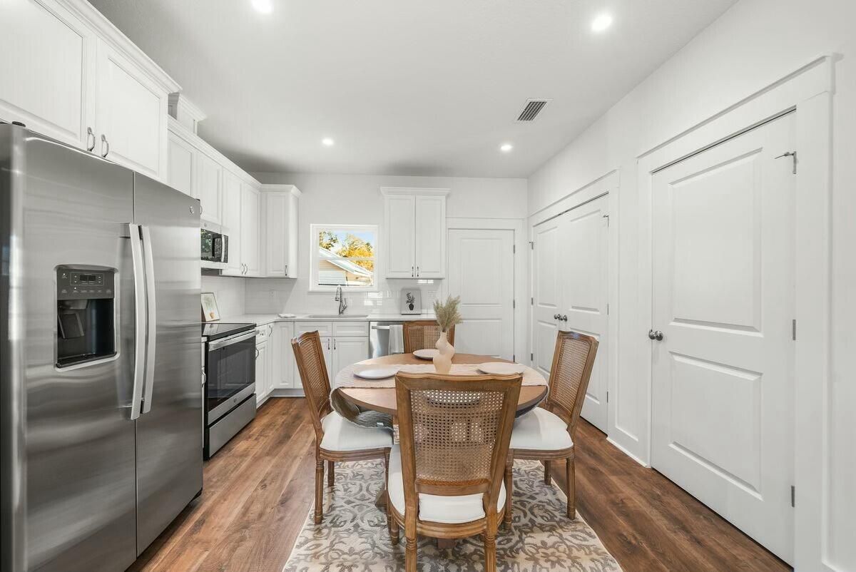 Dining room, Interior, Kitchen, Recessed Lighting, Stainless Steel Appliances, Wood Texture Flooring