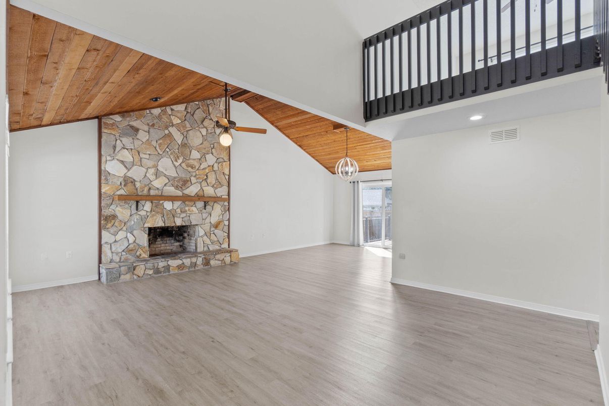 Fireplace, Interior, Pendant Lights, Recessed Lighting, Stone Walls, Wooden Ceilings, Wood Texture Flooring