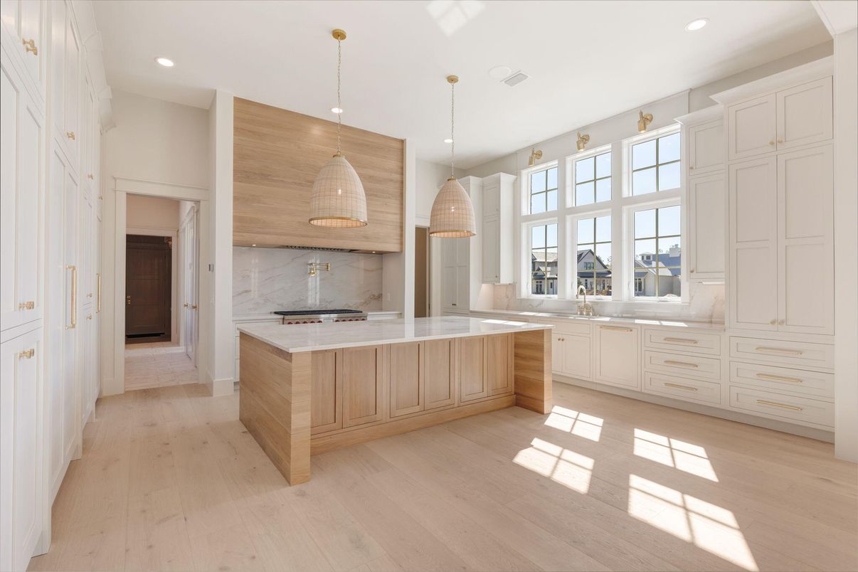 Interior, Kitchen, Marble Walls, Pendant Lights, Recessed Lighting, Stainless Steel Appliances, Wood Texture Flooring