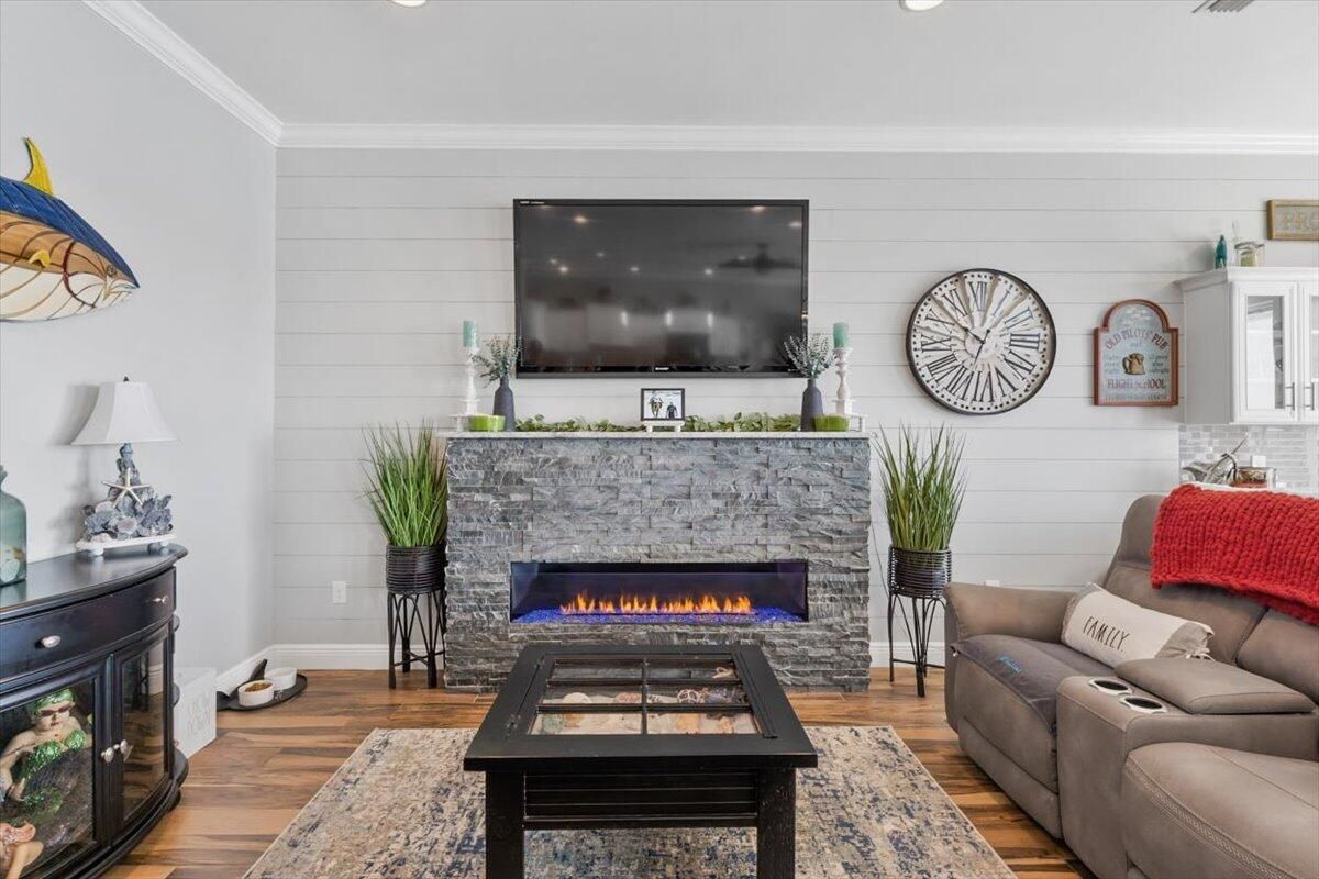 Fireplace, Interior, Living room, Recessed Lighting, Stone Walls, Wood Texture Flooring
