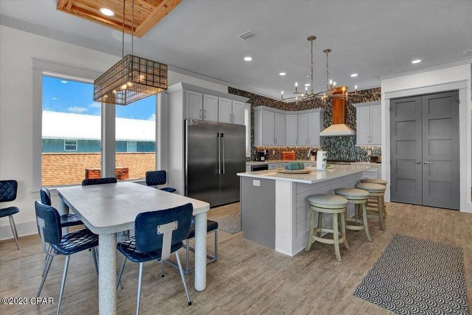 Dining room, Interior, Kitchen, Pendant Lights, Recessed Lighting, Stainless Steel Appliances, Water, Wood Texture Flooring